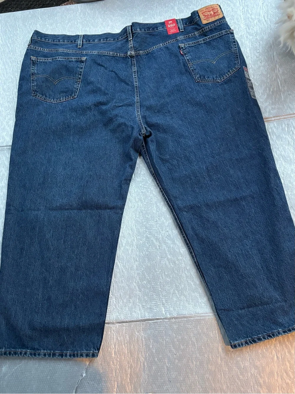 NWT Levi's 550’s with a 63W x 30L relaxed fit.